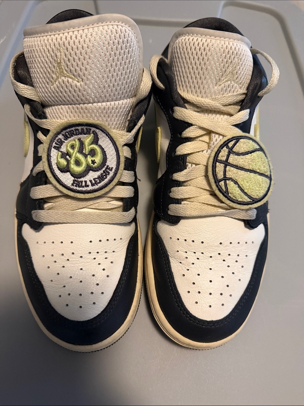Nike Air Jordan 1 Low in White, Black and Cream/Yellow Accents